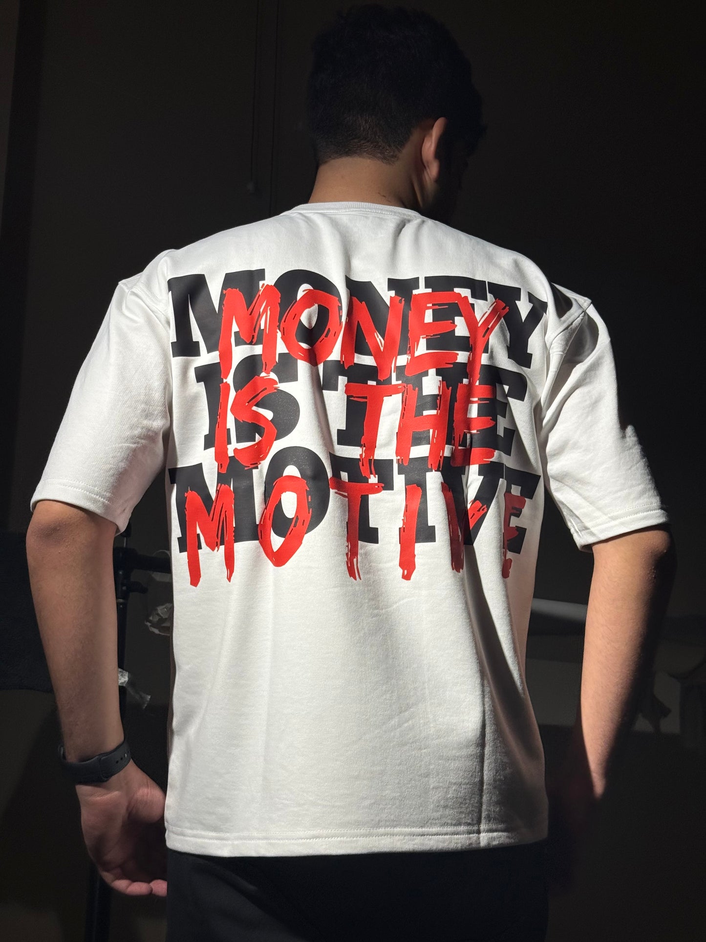 MONEY IS THE MOTIVE UNISEX OVERSIZED T-SHIRT